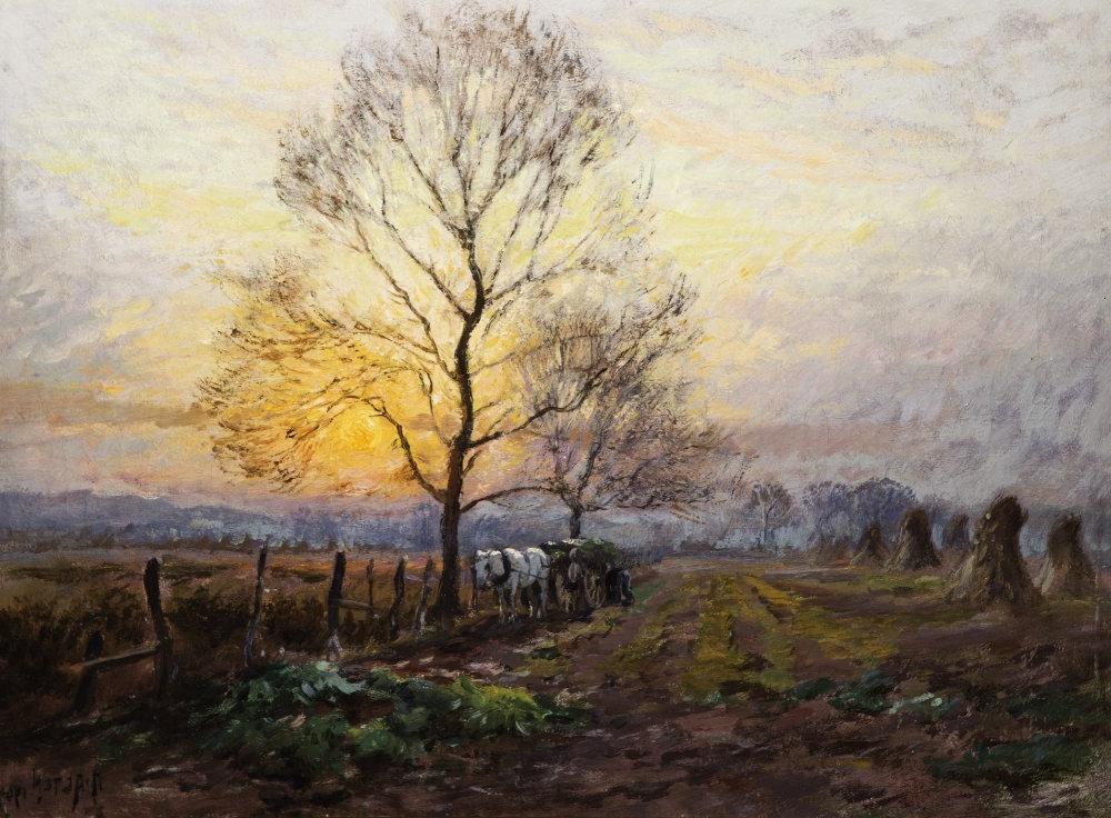 An impressionistic image of a landscape. In the foreground is a tree barren of leaves with a white horse and cart beneath it. A sunset shines through the branches. Upright hay bales are on the left.