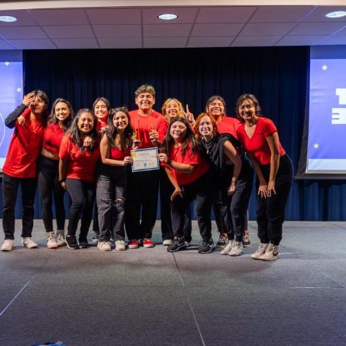 First place winners of last year's lip sync battle posing as a group and smiling holding their first place certification.