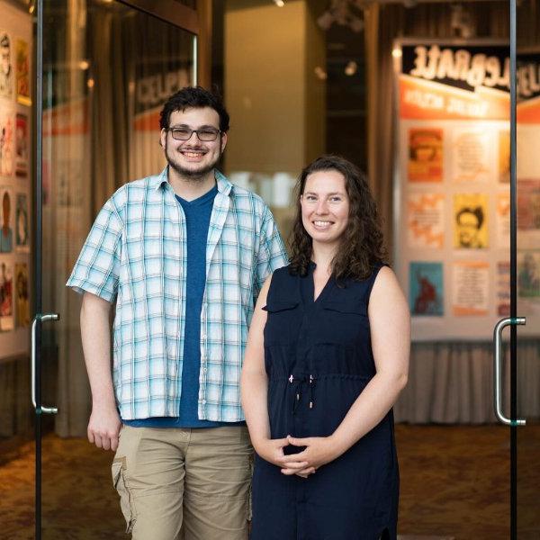 from left are Amber Dierking and Xavier Golden standing in the Mary Idema Pew Library